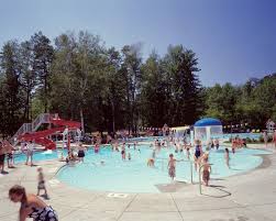 Recreational Family Pool With Zero Depth Entry Water Slide And Water Spray Features Aquatic Design Pool Design Desi Family Pool Water Slides Swimming Pools