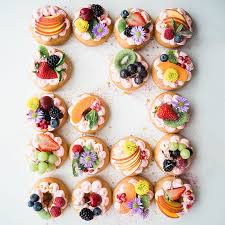 Doughnuts With A Difference Gorgeous Summery Colours And If A Doughnut Has Loads Of Fruit On It It Can T Be Bad Fo Alimentation Cours De Patisserie Dessert