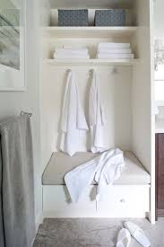 Or, think about a low bench next to the tub to hold your phone or a flameless candle for gorgeous ambience. Cozy Bathroom Nook With Built In Storage Bench Topped With A Greige Bench Cushion Bathroom Storage Bench Built In Bathroom Storage Grey Bathroom Storage