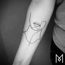 Simple arm tattoos are some of the best for emphasizing strength and fearlessness. Minimalist Tattoos Elegant Body Art Drawn With Just One Line Urbanist