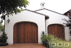 When designing a custom garage door in the spanish colonial style we use elements such as decorative iron clavos, rustic woods such as alder, rough cedar and other wood species that we distress to capture the glamour of the historic spanish colonial styles. Pin By Andrew Denison On Al Fresco Spanish Style Homes Spanish Style Spanish Exterior