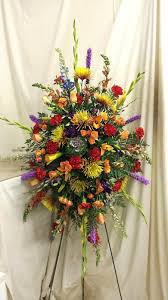 Standing Oval Spray Snap Dragons Orchids Callas Fugis Lilies Delphinium And Kale Orchids Delphinium Funeral Arrangements