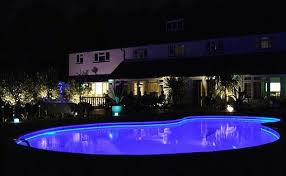 11 Simple Pool Landscaping Ideas That Fit Your Budget Medallion Energy Simple Pool Pool Lights Swimming Pool Lights