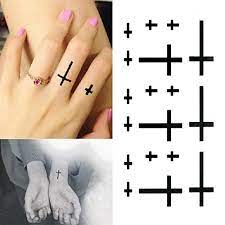 It's a design meant to be enjoyed more by the person getting the tattoo than others looking at it. Oottati Small Cute Temporary Tattoo Cross Finger Wrist Set Of 2 Buy Online In El Salvador At Elsalvador Desertcart Com Productid 52577092