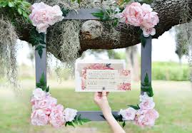 From polaroid cameras to silly props, create a photo booth on a budget with these tips. Diy Bridal Shower Floral Photo Booth Frame Beacon Lane
