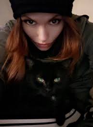 Meet my shadow with eyes. She's got more attitude than I have friends." 🖤👀