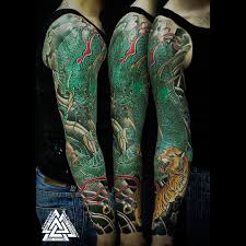 Cherry blossom and dragon tattoos for women. Traditional Dragon Tattoo On Man Right Full Sleeve