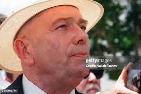 STATES, James Bert McDougal and his wife were financial partners with...  News Photo