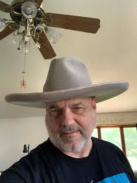 Traditional hat brim styling with heat set pencil curl