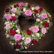 They're in their element in spring, and at that time we recommend taking a seat on one of the benches to enjoy not only views of flowering shrubs covered in pastel blooms, but to take in the delicate scent of rose and lavender being carried along by the wind. Pink Red Rose Heart The Cottage Garden Flower Shop Dunstable S Original Florists Red Roses Funeral Flowers Rose