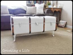 Crafted with a replicated antique look, this steamer trunk coffee table is ideal as a decorative, yet functional accent. Creating A Life Studio Vintage Trunk Coffee Table