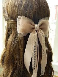 Then start braiding a halo braid that almost completely covers the bandana, only leaving the bow on the top visible as a little pop of color. 32 Adorable Hairstyles With Bows