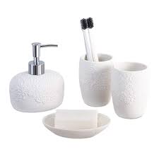 A striped black and white curtain helps you could even add some bath tub accessories such as a black pillow and tray to tie the space together. White Bathroom Accessories Set 4 Pieces With Soap Lotion Dispenser Soap Dish And 2 Tumblers For Bathroom Kitchen Countertop Ceramic Embossed Bathroom Set Buy Online In Belize At Belize Desertcart Com Productid 91770049