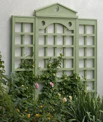 Two wood framed panels joined together with hinges, these garden trellis panels can be stored flat when not in use. How To Attach A Trellis To A Wall Garden Gate