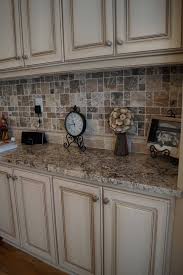 Cabinets Refinished To A Custom Off White Finish With Heavy Glaze Love The Tile Back Splash Rustic Kitchen Cabinets Kitchen Cabinets Makeover Kitchen Remodel