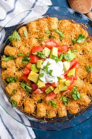 Combine the ground beef mixture with canned diced tomatoes, green chiles, corn, and black beans. Taco Tater Tot Casserole Neighborfood