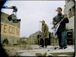 Written by noel gallagher, it was released on 7 july 1997 as the first single from their third album be here now (1997). Oasis Reveal Remastered Video For D You Know What I Mean Radio X