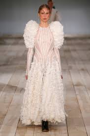 A Closer Look The Making Of An Upcycled Alexander Mcqueen Spring 2020 Runway Gown Fashionista A biker jacket with black tulle exploded sleeves and peplum, with a blush tulle skirt. the making of an upcycled alexander