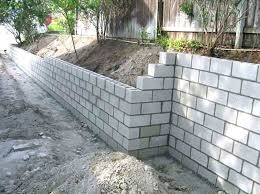 At this point it would be a good idea to spend a little extra and apply dryloc. Latest Pic Retaining Walls Construction Concepts Cinder Block Garden Wall Concrete Block Retaining Wall Backyard Retaining Walls