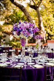 Purple And Champagne Flowers Pretty Flowers Has A Flower Arrangements For Every Wedding Sty Purple Wedding Theme Dark Purple Wedding Wedding Centerpieces