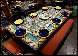 The table not only serves as a spot for eating, but it also anchors decor. Furthur Wholesale Mosaic Dining Tables