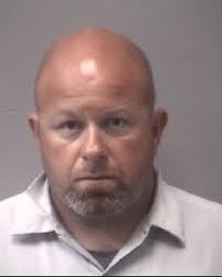 Man charged with secretly peeping at child for photographs