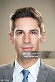 Portrait Of A Businessman Looking Into Camera High-Res Stock Photo