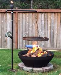 Bbq grill over fire pit. My Custom Swinging Fire Pit Bbq Cooking Grate The Cooking Grate Raises And Lowers Manually With The Winch And Rotates Fire Pit Bbq Backyard Fire Easy Diy Bbq