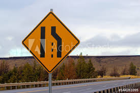 Promote safe driving on narrow roads & prevent accidents. Narrow Road Ahead Stock Photo Adobe Stock