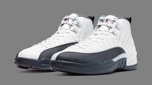 This shoe is a refined celebration of the amateur world cup of basketball. Air Jordan 12 Retro White Dark Grey Gym Red 130690 160 Release Date Sole Collector