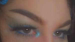 After a decade of warm tones, blue eyeshadow is back. ï¾ Nostalgic Blue Eyeliner ï¾ Blue Eyeliner Makeup No Eyeliner Makeup Y2k Makeup