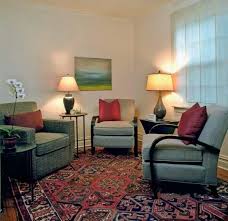 Simple And Clean Therapist S Office With Color Coordinating Chairs Artwork And Rug Therapy Office Decor Therapist Office Decor Counseling Office Decor