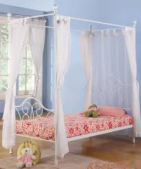 The requirements to build this design are wood for the bed and headboard, cut them as per your measurements, drill the holes and form the feet of the bed, construct the platform, cut out the headboard panels and assemble the pieces. White Twin Size Canopy Bed Twin Canopy Bed Frame Canopy Bed Frame Twin Canopy Bed