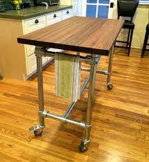 Sand down the table with a palm sander to remove old paint and stain. How To Make A Butcher Block Table Simplified Building