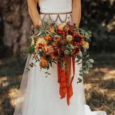 Fall weddings are so romantic and the change of season has us all smitten. 15 Sunflower Wedding Bouquets