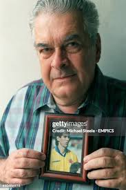 Andres Escobar's father Dario Escobar, with a picture of his son News Photo 