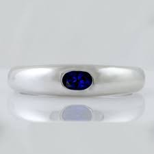Tanzanite Thumb Ring A Beautiful Vibrant Blue Tanzanite Sits Pride Of Place In Three Stone Engagement Rings Tsavorite Engagement Ring Stone Engagement Rings