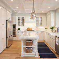 A freestanding island offers additional storage along with a convenient surface for folding clothes, reading the newspaper, or sharing a cup of coffee while you get dressed. Narrow Kitchen Island Design Ideas