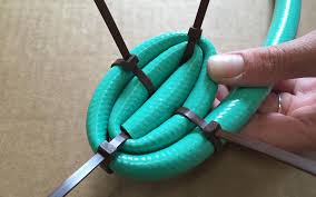 Identify where this outdoor basket will be helpful. Garden Hose Basket Sierra Club