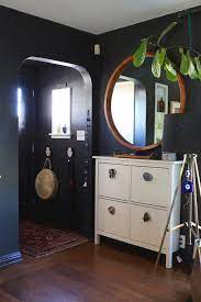 this family s downsized dream home is full of surprises a cup of jo ikea shoe cabinet entryway shoe storage entryway shoe