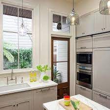 A frosted glass panel is added on the upper part to utilize the daylight. Glass Paned Back Door Design Ideas
