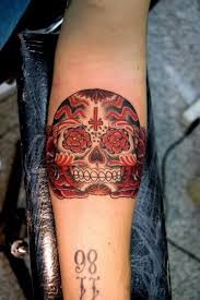 Many people like it as a first tattoo because it's simple and draws the eye, but it's worth exploring what it really means and symbolizes. Black Red Sugar Skull Forearm Tattoo Tattooimages Biz