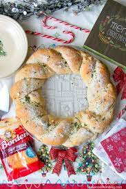 Line a pizza pan or large baking sheet with parchment paper. Cheesy Pull Apart Bread Wreath The Soccer Mom Blog