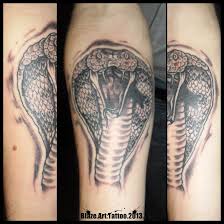 Cobra tattoos are glorious vessels of masculine flair. King Cobra Tattoos