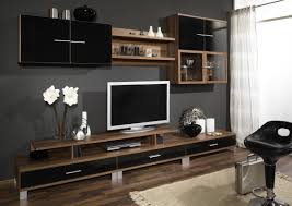 Seductive Tv Wall Unit Design On The Brown Wooden Cupboard And Drawer Also Floating Black Cabinet And She Wall Unit Decor Wall Tv Unit Design Wall Unit Designs