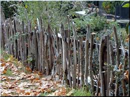 Wooden Fence Made From Branches Natural Industrial Loft F Rustic Garden Fence Rustic Fence Garden Edging