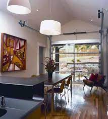 They are very similar to your standard overhead garage door; Clopay Door Blog Glass Garage Doors Open Up Interior Spaces