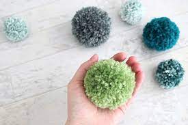 Learn how to make yarn pom poms. My Secret To Making Fluffy Pom Poms Every Time With Any Kind Of Yarn Aubree Originals