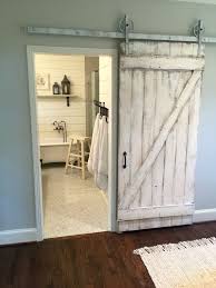 Diy sliding barn door hardware is available in all manner of styles and budgets, and the door options are limitless—from salvage finds to original diy creations like this one, a mix of pallet wood and common cedar. Shabby Chic Z Sliding Barn Door White Barn Door White Barn Door Barn Door Projects Shabby Chic Bathroom