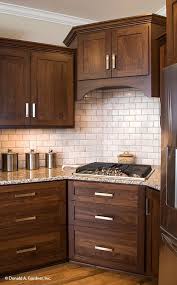Cabinets And Drawers Make For Easy Storage In This Kitchen The Peyton Plan 1289 H Brown Kitchen Cabinets Walnut Kitchen Cabinets Stained Kitchen Cabinets